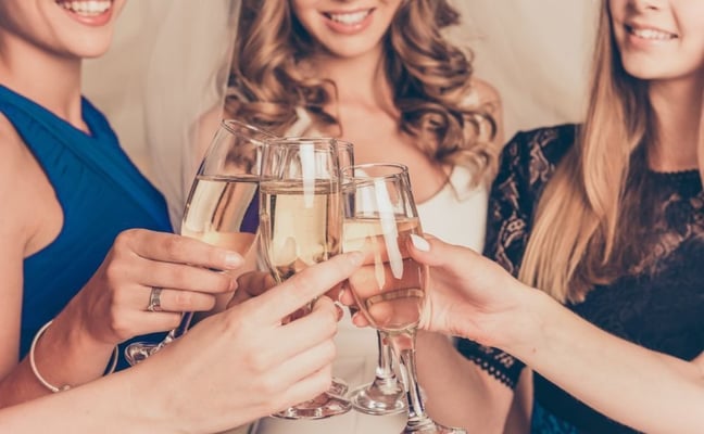 Women clinking champagne glasses